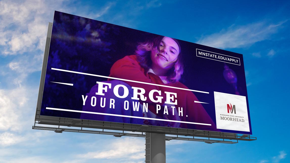 Billboard for MSUM with young female college student on it. Forge your Own Path.